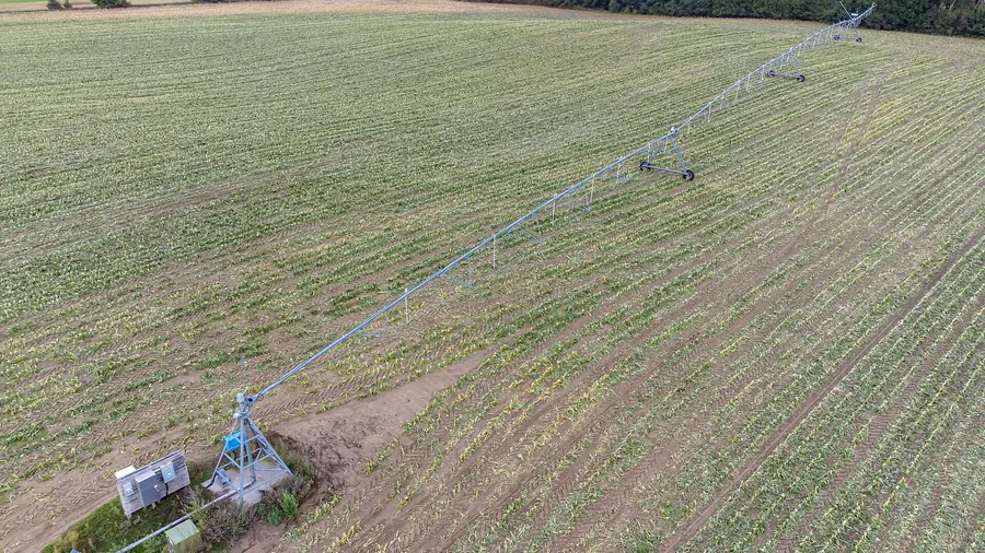 Concrete-lined irrigation canal feeding a farm distribution network